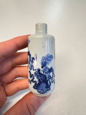 A Chinese blue and white 'Mythical Animals' snuff bottle and a 'Buddhist Lions' snuff bottle — photo 1