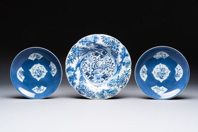 A Chinese blue and white 'phoenix and monkeys' dish and a pair of powder-blue-ground plates, Kangxi/Yongzheng
