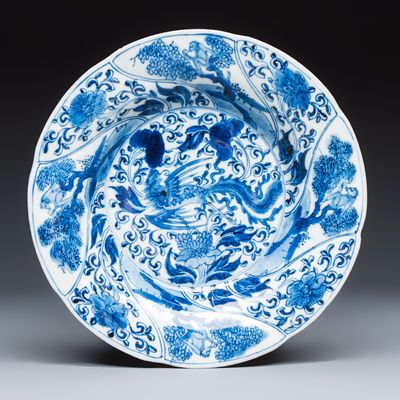 A Chinese blue and white 'Phoenix and Monkeys' lobed plate, flower mark, Kangxi