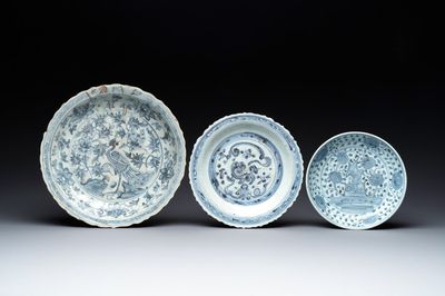 A Chinese blue and white 'phoenix' dish and two 'Buddhist lion' and 'peony' plates, Hongzhi/Zhengde