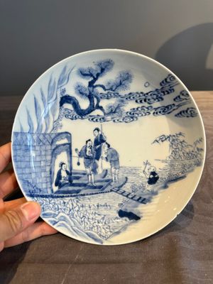 A Chinese blue and white plate with a breastfeeding woman and fishermen on boats, Yongzheng — photo 1