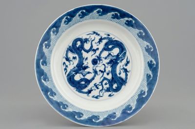 A Chinese blue and white plate with dragons chasing the pearl, Kangxi
