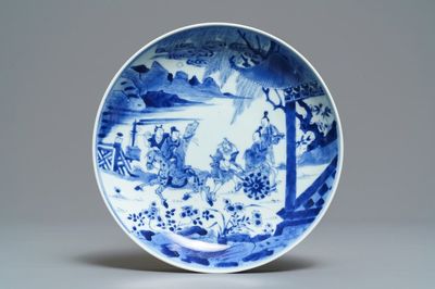 A Chinese blue and white plate with figures in a garden, Yongzheng