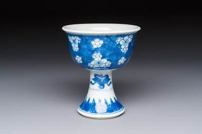 A Chinese blue and white 'Prunus on Cracked Ice' stem bowl, Kangxi