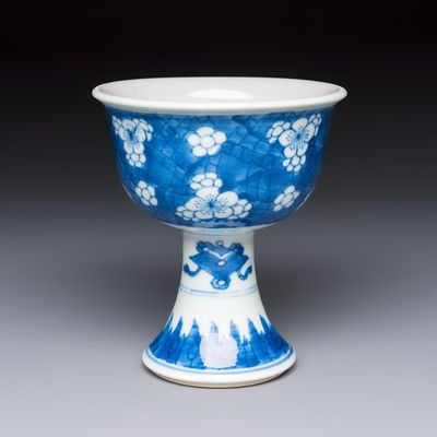 A Chinese blue and white 'Prunus on Cracked Ice' stem bowl, Kangxi