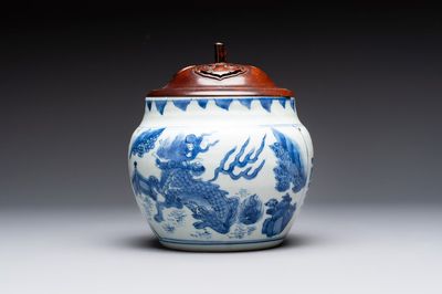 A Chinese blue and white 'qilin' jar and wooden cover, Transitional period