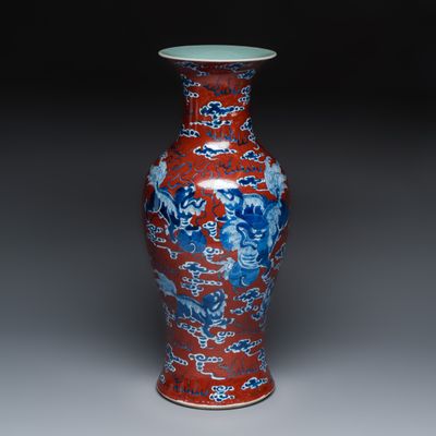 A Chinese blue and white red-ground 'Buddhist Lion' vase, 19th C.