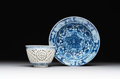 A Chinese blue and white reticulated double-walled cup and saucer, lingzhi mark, Kangxi