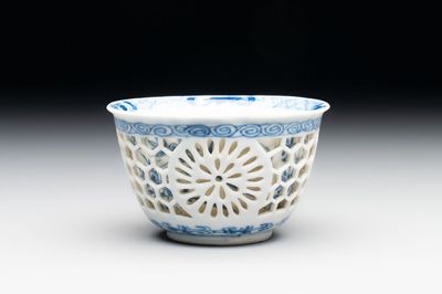 A Chinese blue and white reticulated double-walled cup, ruyi mark, Kangxi