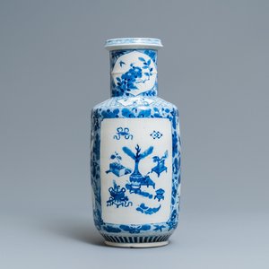 A Chinese blue and white rouleau vase with antiquities and floral designs, 19th C. — 照片 1