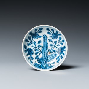 A Chinese blue and white saucer with a pheasant behind a rock, 'rabbit' mark, Wanli — photo 1