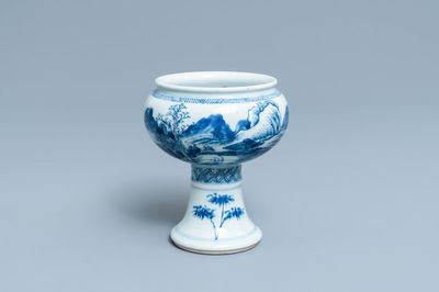 A Chinese blue and white stem cup with a continuous landscape scene, Kangxi/Yongzheng