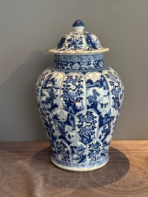 A Chinese blue and white vase and cover with landscapes and flowers, Kangxi — photo 1