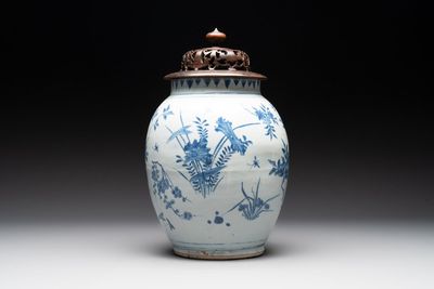 A Chinese blue and white vase with floral design and wooden cover, Transitional period