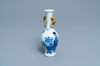A Chinese blue and white vase with gilt elephant-head handles, Kangxi