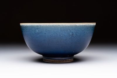 A Chinese blue-glazed 'Hatcher Cargo' bowl with incised dragons, Transitional period