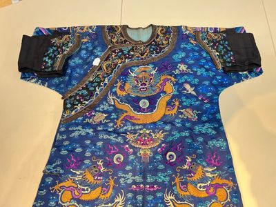 A Chinese blue-ground embroidered silk 'Dragon' robe, 'Ji Fu' 吉服, 19th C. — 照片 1