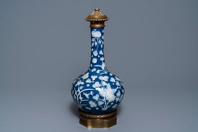 A Chinese blue-ground slip-decorated bottle vase with ormolu mounts, 19th C.