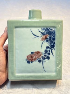 A Chinese blue, white and copper-red celadon-ground tea caddy with floral and bamboo design, Qianlong mark and of the period — photo 1
