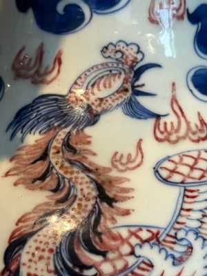 A Chinese blue, white and copper-red 'dragon and phoenix' vase, 19th C. — photo 15