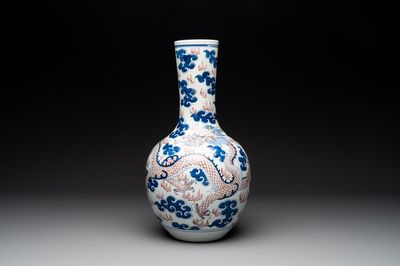 A Chinese blue, white and copper-red 'dragon and phoenix' vase, 19th C.