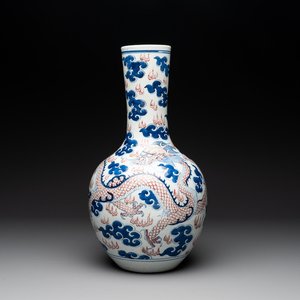 A Chinese blue, white and copper-red 'dragon and phoenix' vase, 19th C. — photo 1