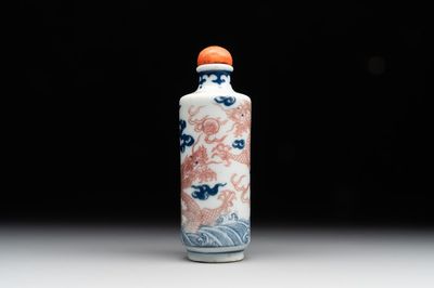 A Chinese blue, white and copper-red 'dragon' snuff bottle, 19th C.