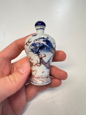 A Chinese blue, white and copper-red 'Dragon' snuff bottle — photo 1