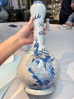 A Chinese blue, white and copper-red garlic-mouth vase with mythical animals, Kangxi mark, 19th C. — photo 1