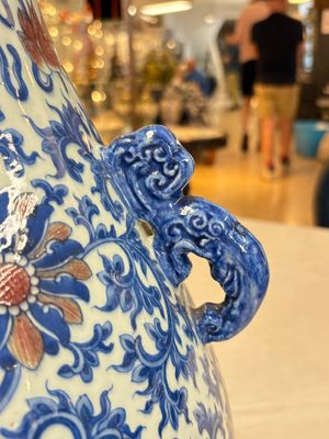 A Chinese blue, white and copper-red 'hu' vase with lotus scrolls, Qianlong mark, 19th C. — photo 11