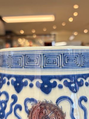 A Chinese blue, white and copper-red 'hu' vase with lotus scrolls, Qianlong mark, 19th C. — photo 12