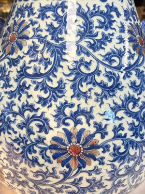 A Chinese blue, white and copper-red 'hu' vase with lotus scrolls, Qianlong mark, 19th C. — photo 8