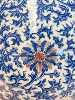 A Chinese blue, white and copper-red 'hu' vase with lotus scrolls, Qianlong mark, 19th C. — photo 9