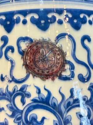 A Chinese blue, white and copper-red 'hu' vase with lotus scrolls, Qianlong mark, 19th C. — photo 10