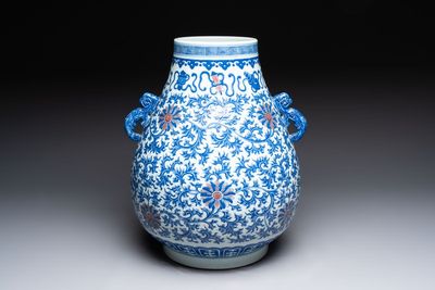 A Chinese blue, white and copper-red 'hu' vase with lotus scrolls, Qianlong mark, 19th C.