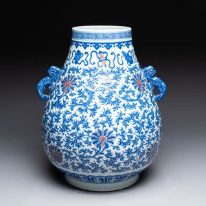 A Chinese blue, white and copper-red 'hu' vase with lotus scrolls, Qianlong mark, 19th C. — photo 1