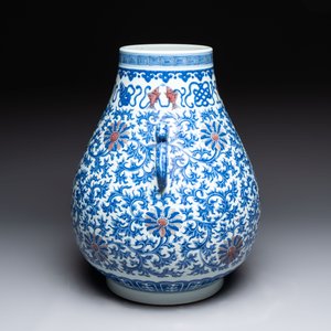 A Chinese blue, white and copper-red 'hu' vase with lotus scrolls, Qianlong mark, 19th C. — photo 2