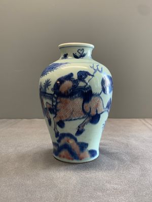 A Chinese blue, white and copper-red 'kylin and phoenix' vase, 19th C. — photo 1