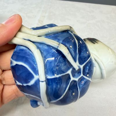 A Chinese blue, white and copper-red lotus-form water dropper — photo 9
