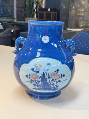 A Chinese blue, white and copper-red powder-blue-ground 'hu' vase, Qianlong — photo 1