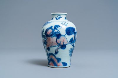 A Chinese blue, white and copper red 'qilin and phoenix' vase, Qing