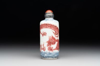 A Chinese blue, white and copper-red snuff bottle with a dragon, dragon mark, 19th C.