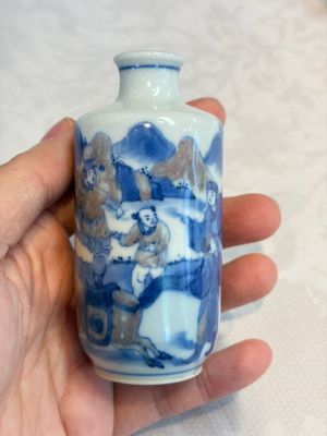 A Chinese blue, white and copper-red snuff bottle with narrative design, 19th C. — photo 1