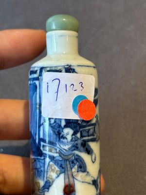 A Chinese blue, white and copper-red 'warriors' snuff bottle, Kangxi mark, 19th C. — photo 1