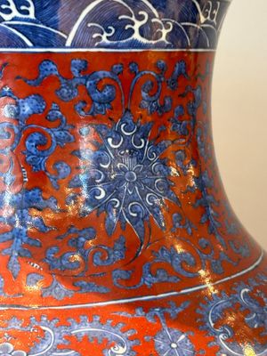 A Chinese blue, white and iron-red 'bajixiang' 'hu' vase on wooden stand, Qianlong mark, 19th C. — photo 6