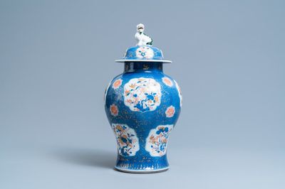 A Chinese blue, white, iron red and gilt powder blue-ground vase and cover, Kangxi