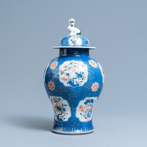 A Chinese blue, white, iron red and gilt powder blue-ground vase and cover, Kangxi — photo 1