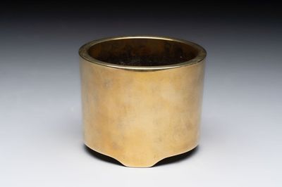 A Chinese bronze cylindrical tripod censer, Xuande mark, 18th C.