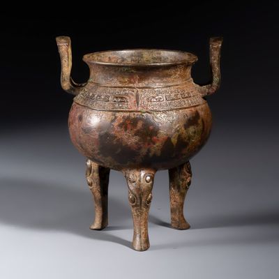 A Chinese bronze ding-form tripod censer with handles, Ming