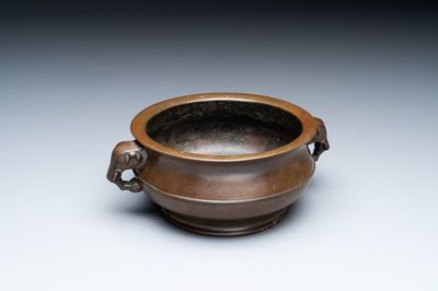 A Chinese bronze elephant-head-handled censer, Wan Shou Wu Jiang 萬壽無疆 mark, 19th C.